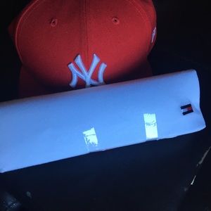 New York hat and Tommy Hilfiger shirt